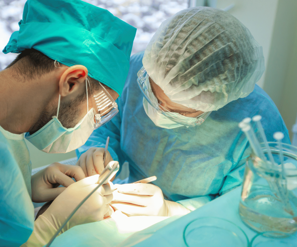 Photo of two Thai surgeons performing a hair transplant procedure
