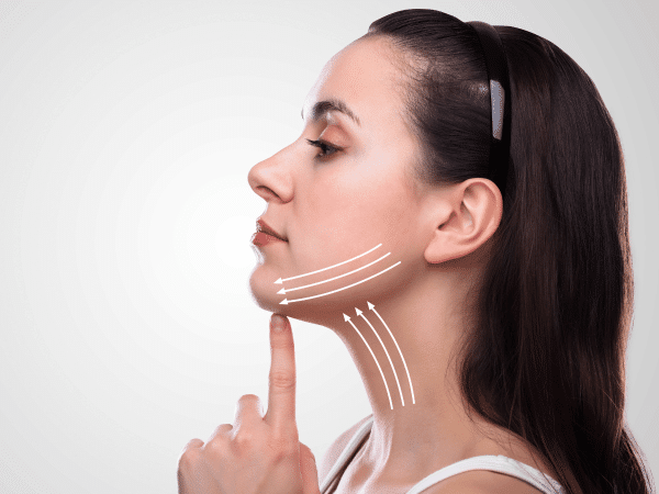 A girl lifting her chin, getting ready for a necklift in Thailand