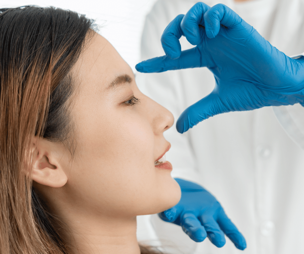 A woman getting her nose checked up by a doctor in order to get Rhinoplasty in Thailand